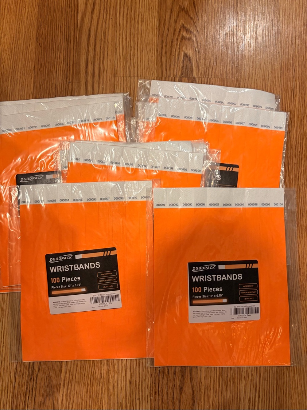 DGBDPACK Orange Adhesive Event Wristbands - 100 Pack